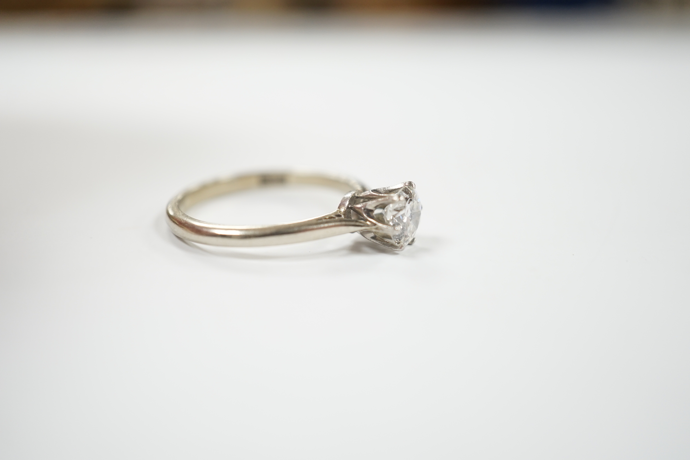 An 18ct and solitaire diamond set ring, size M, gross weight 1.9 grams, the stone diameter 5.5mm.